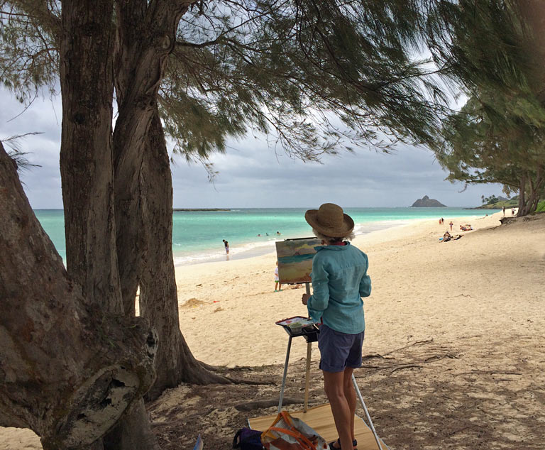 Jennifer painting at the beach